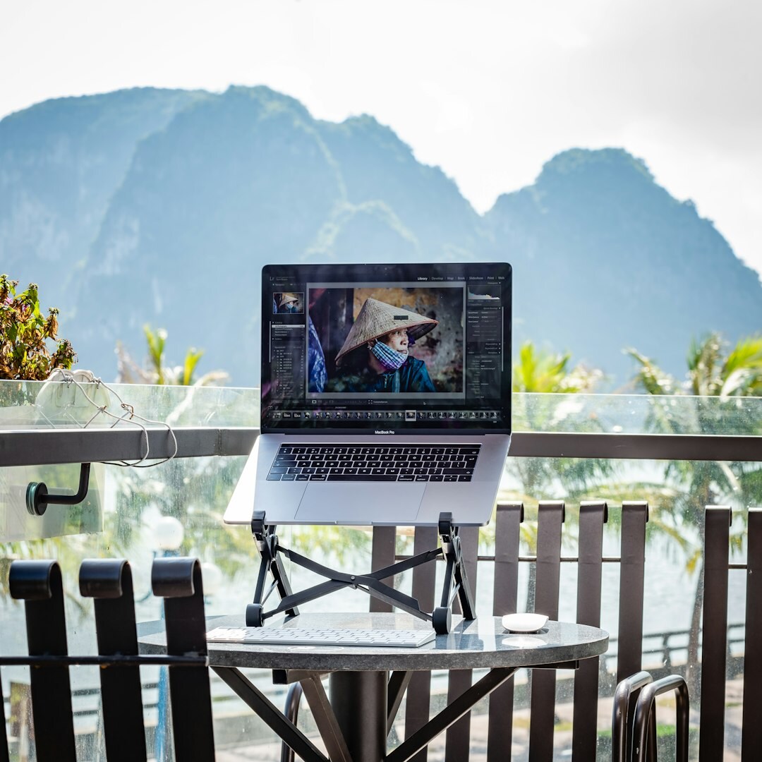 Journalist verifying a viral photo using reverse image search on a laptop