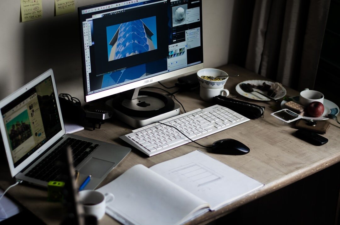 Desk setup for verifying visual sources with two monitors and a printed image